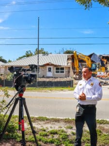 Man in uniform speaks to camera.